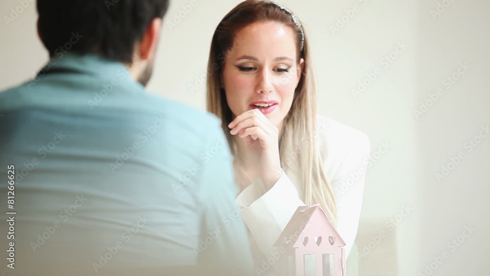 Beautiful blond woman talking to man in restaurant environment Beautiful blond woman talking to man in restaurant environment