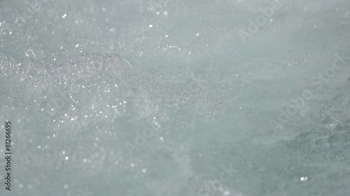 closeup bubbling warm water slow motion
