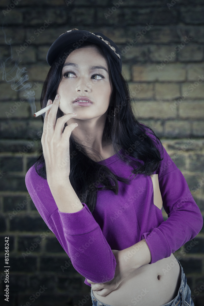 Casual girl smoking a cigarette
