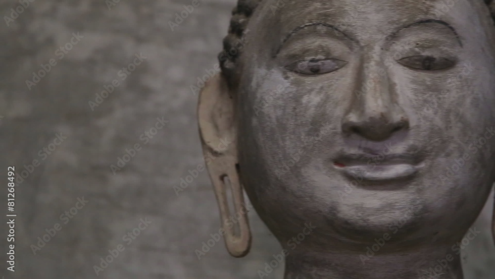 DAMBULLA, SRI LANKA - FEBRUARY 2014: Close up view of sitting Buddha at the Golden Temple of Dambulla. The Golden Temple of Dambulla is a World Heritage Site in Sri Lanka. DAMBULLA, SRI LANKA - FEBRUARY 2014: Close up view of sitting Buddha at the Golden Temple of Dambulla. The Golden Temple of Dambulla is a World Heritage Site in Sri Lanka.