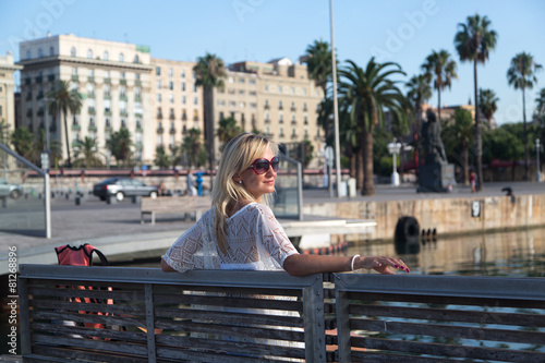Young woman enjoys the evening in Barcelona.