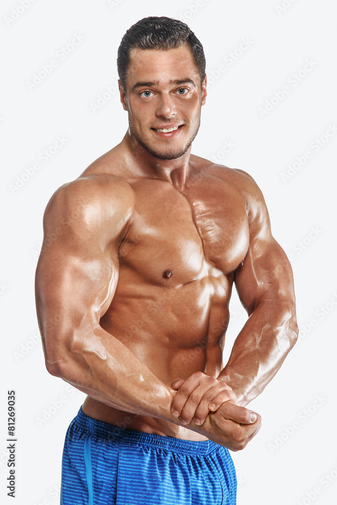 Fitness man posing in studio