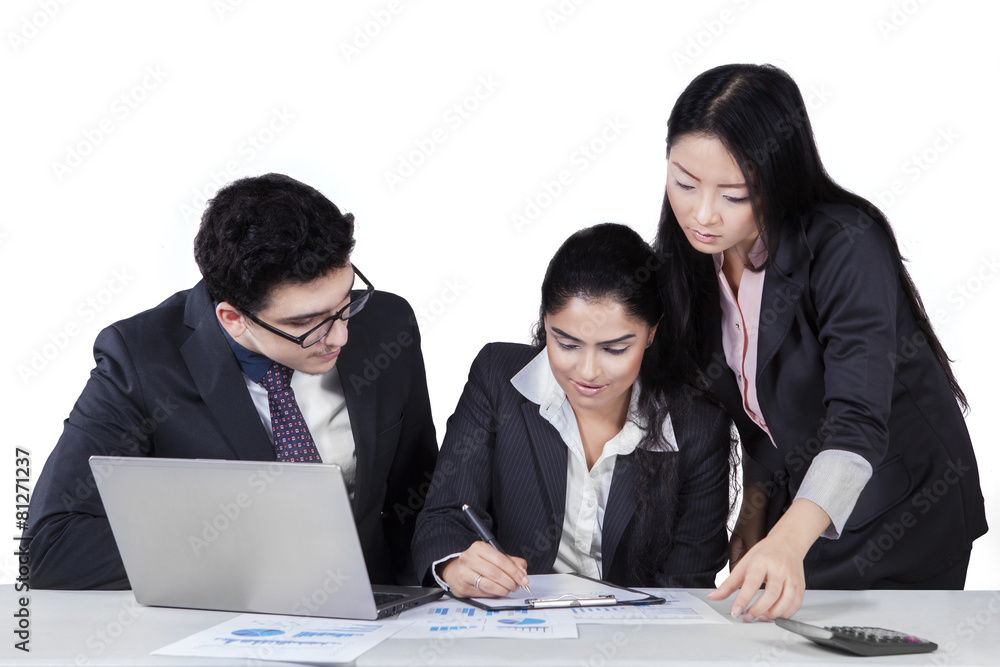 Two managers looking their partner signing document Two managers looking their partner signing document