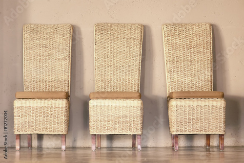 Three thatch chairs