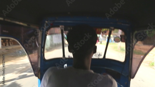 WELIGAMA, SRI LANKA - MARCH 2014: Interior view of driving a tuktuk in Weligama. Tuktuks are commonly used for transport in the country. photo