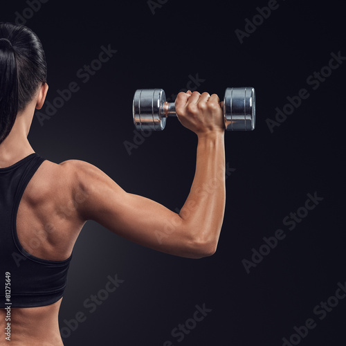 Fitness woman in training muscles of the back with dumbbells #81275649