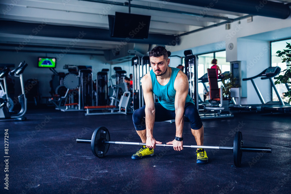 Crossfit instructor at the gym doing Deadlift exercises Crossfit instructor at the gym doing Deadlift exercises