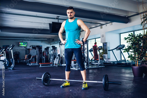 Crossfit instructor at the gym doing Deadlift exercises