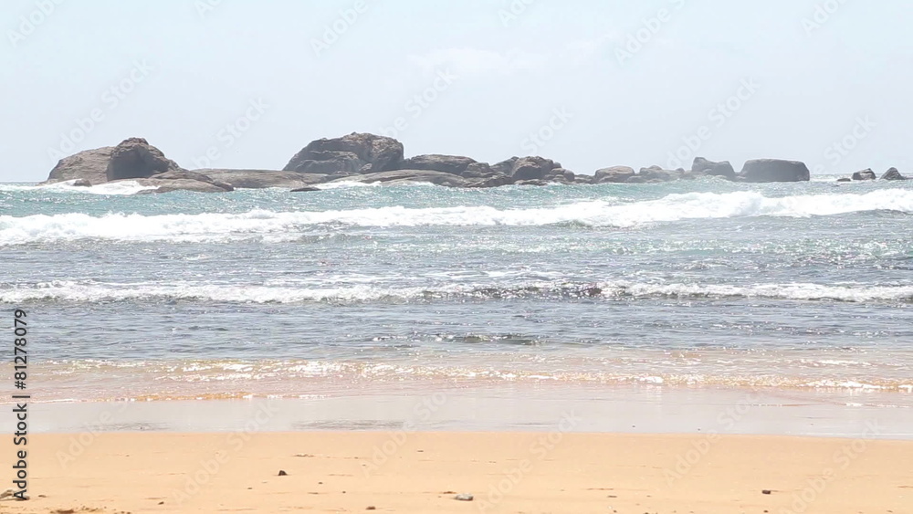 Ocean view in Hikkaduwa with waves splashing the beach. Hikkaduwa is famous for its beautiful sand beaches. Ocean view in Hikkaduwa with waves splashing the beach. Hikkaduwa is famous for its beautiful sand beaches.