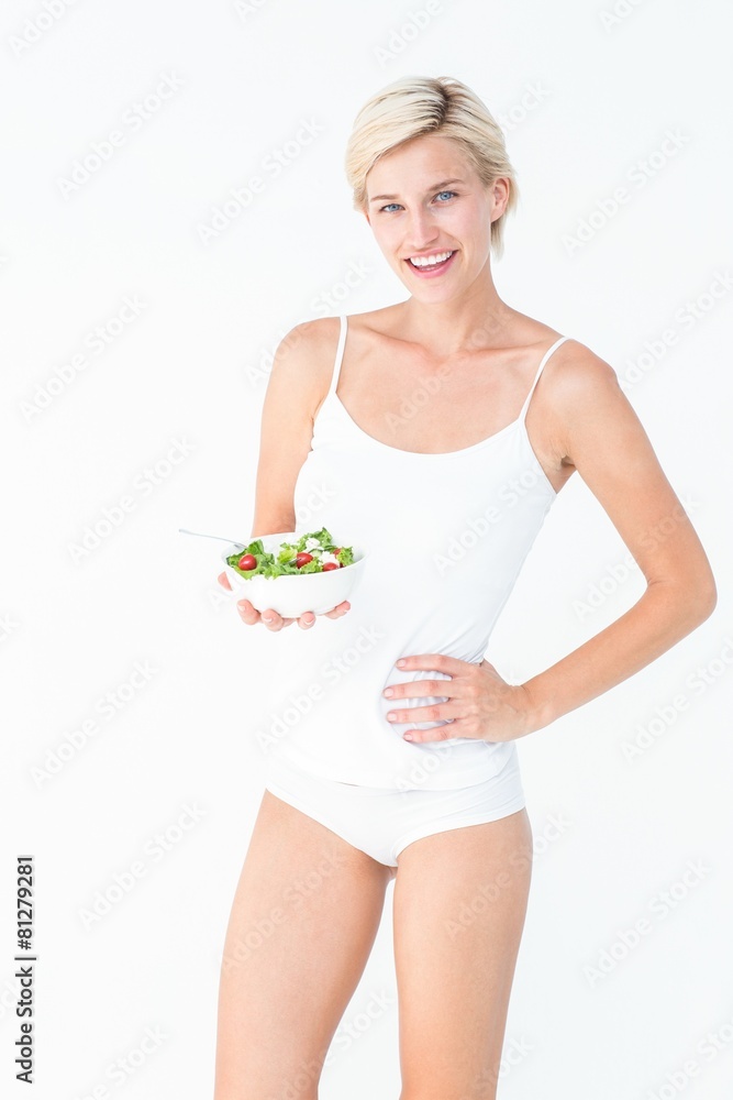 Beautiful fit woman holding a bowl of salad Beautiful fit woman holding a bowl of salad