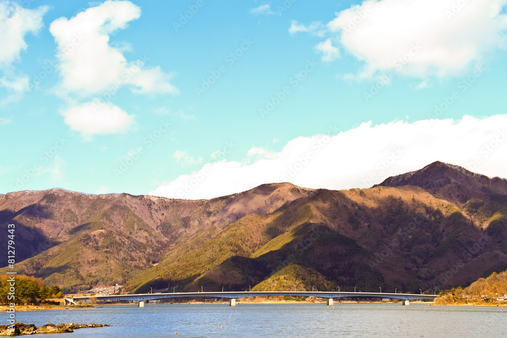 bridge Of Lake Kawaguchiko with the background of mountain and b