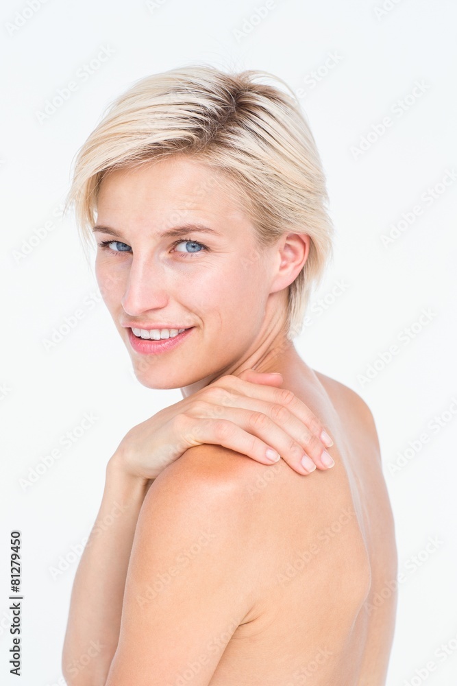 Attractive woman touching her shoulder Attractive woman touching her shoulder