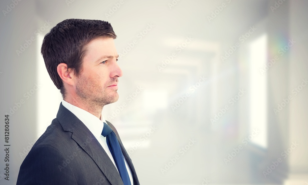 Composite image of handsome businessman looking away Composite image of handsome businessman looking away