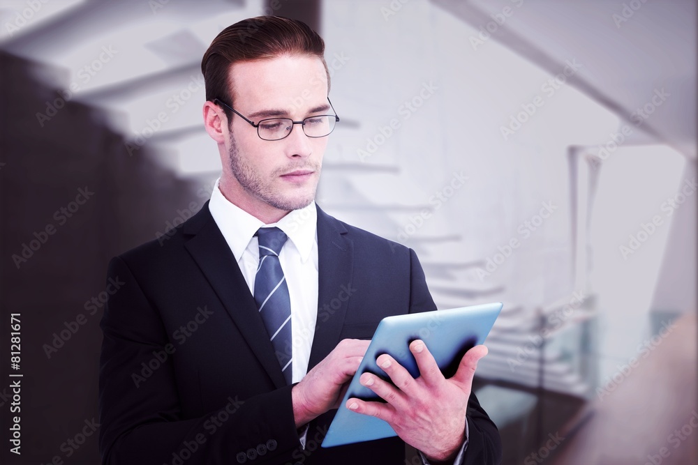 Composite image of unsmiling businessman using tablet pc Composite image of unsmiling businessman using tablet pc