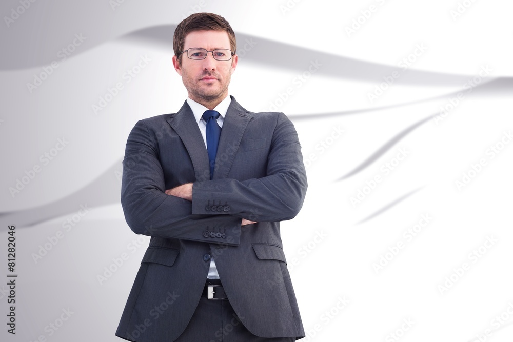 Composite image of frowning businessman looking at camera Composite image of frowning businessman looking at camera