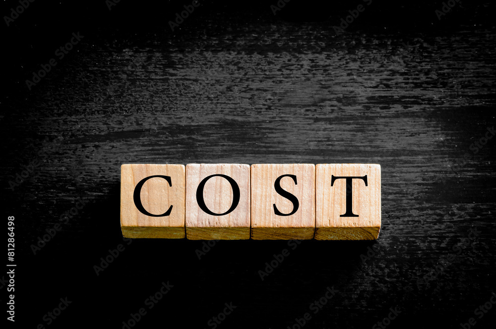 Word COST isolated on black background with copy space