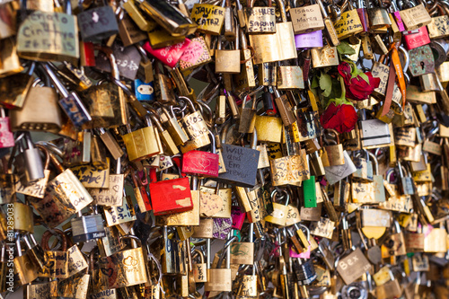 Lots of Padlocks at River Seine, Paris France, symbolizing Love