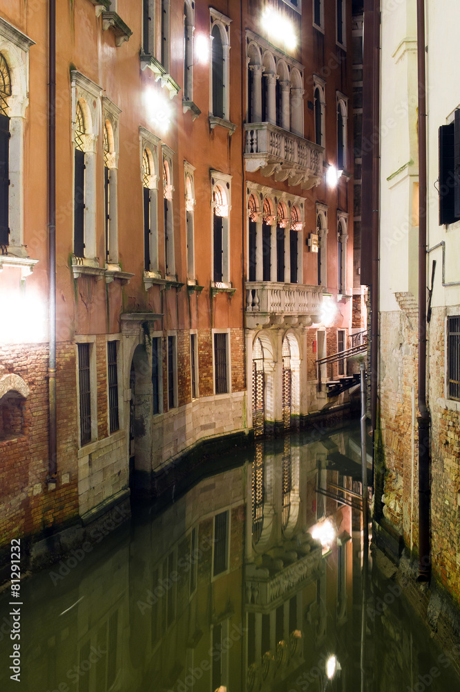 Night channel with old buildings in Venice