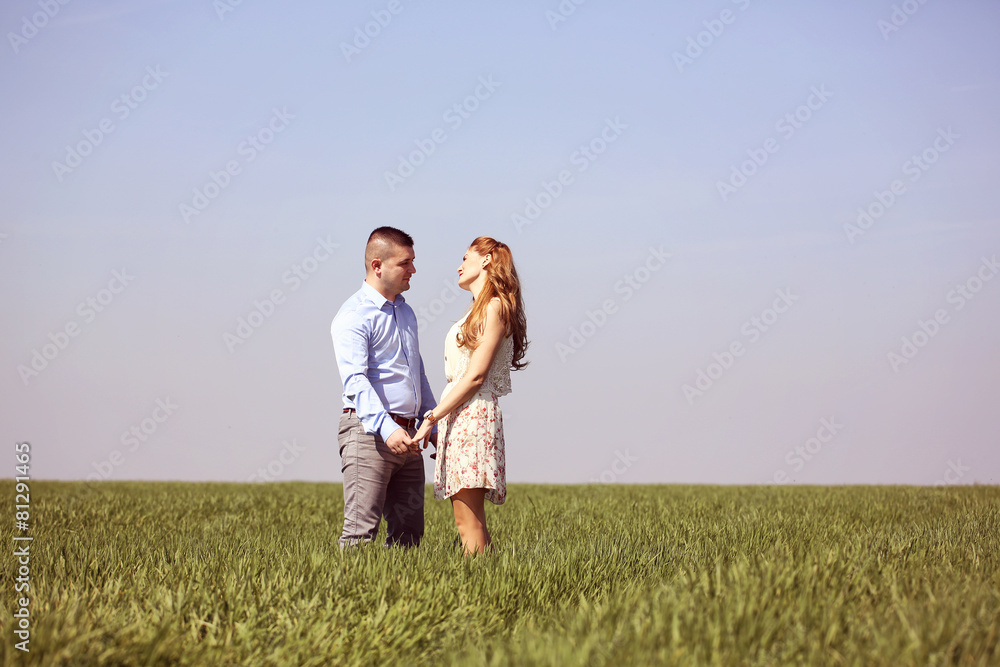 Young couple in green fields