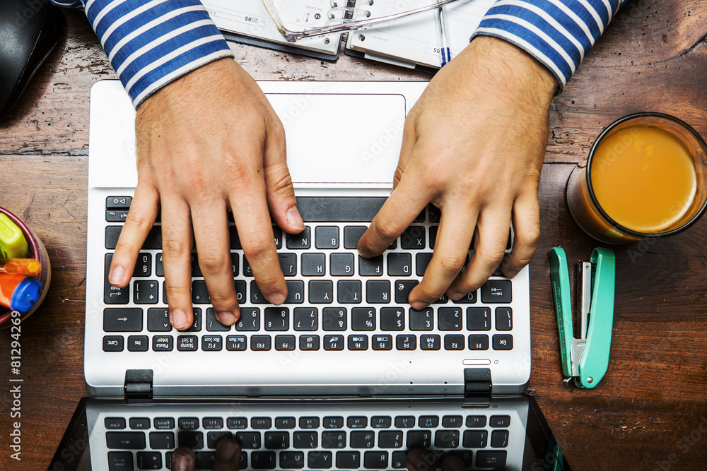 hands on the keyboard of a laptop on the desk work hands on the keyboard of a laptop on the desk work