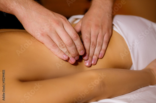 masseur doing massage beautiful girl © anikanes