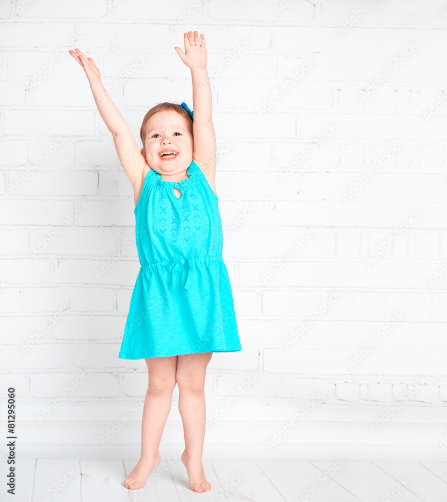 happy little girl raised her hands up and measure your height happy little girl raised her hands up and measure your height