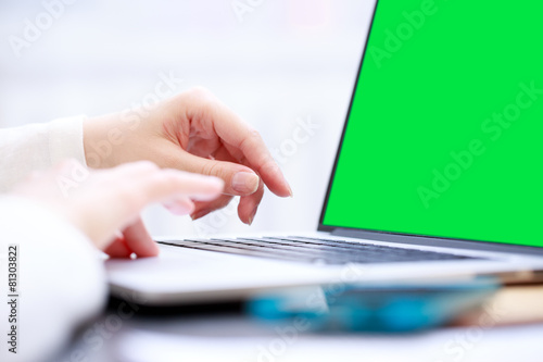 Close-up shot typing on the laptop keyboard