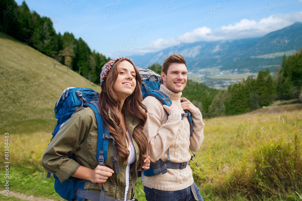 smiling couple with backpacks hiking smiling couple with backpacks hiking