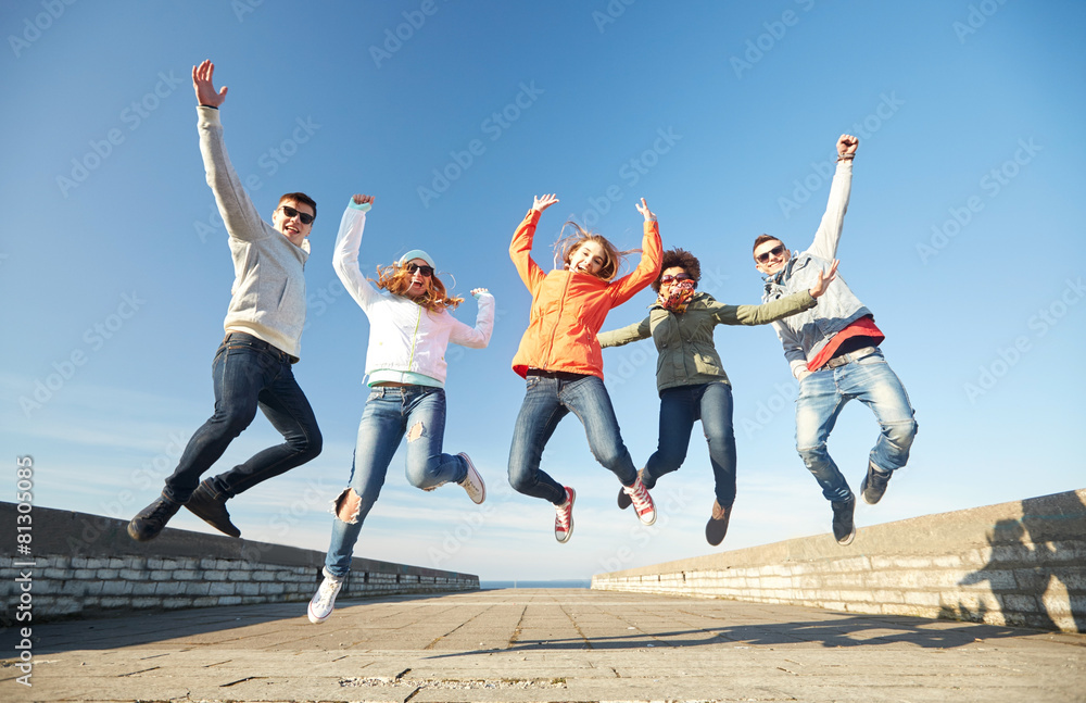 smiling friends in sunglasses laughing on street smiling friends in sunglasses laughing on street
