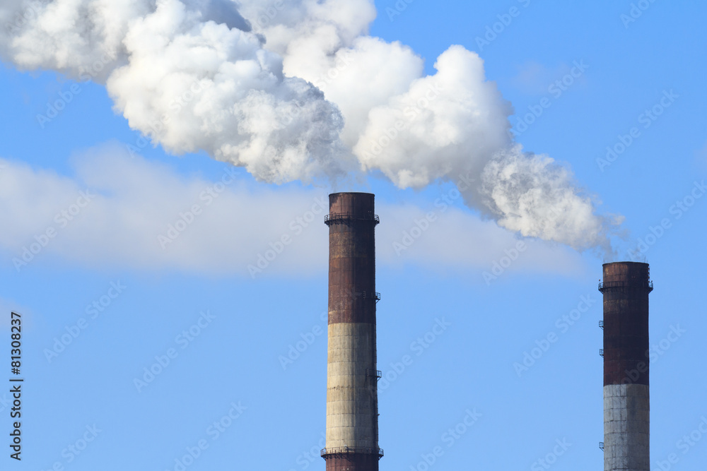 Industrial smoke from chimney on blue sky Industrial smoke from chimney on blue sky