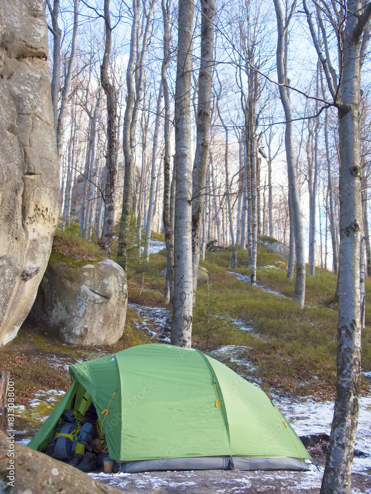 Tent under rocks.