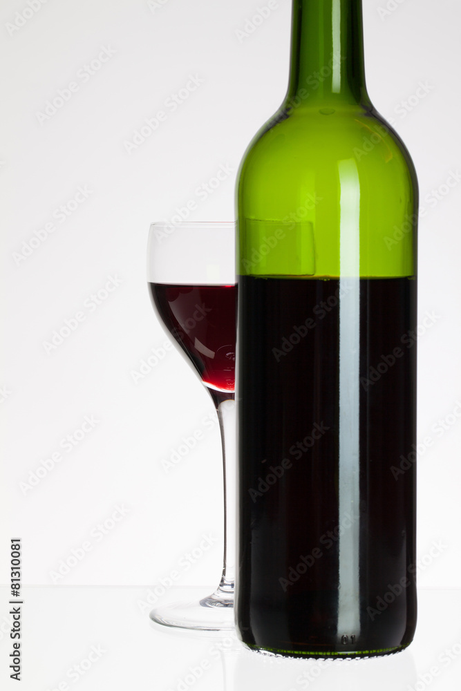 Wine glass and bottle with red wine Wine glass and bottle with red wine