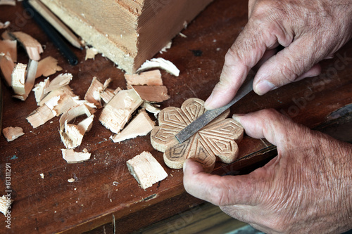 Obraz na plátně cabinetmaker's hands using rasp on a piece of wood