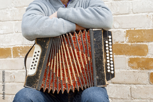 concertina on the man's knee photo