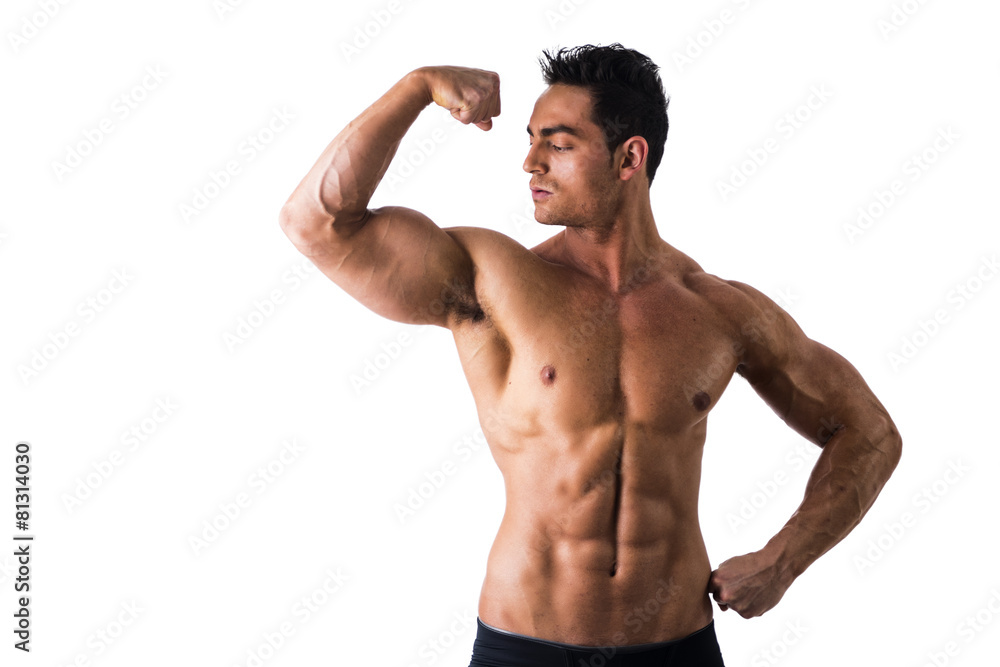 Shirtless Athletic Young Muscle Man Staring at his Biceps Shirtless Athletic Young Muscle Man Staring at his Biceps