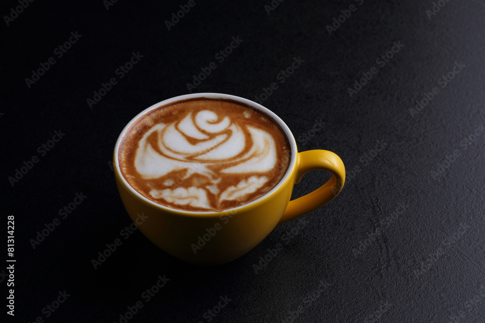 Cup of cappuccino and sugar bowl on black background Cup of cappuccino and sugar bowl on black background