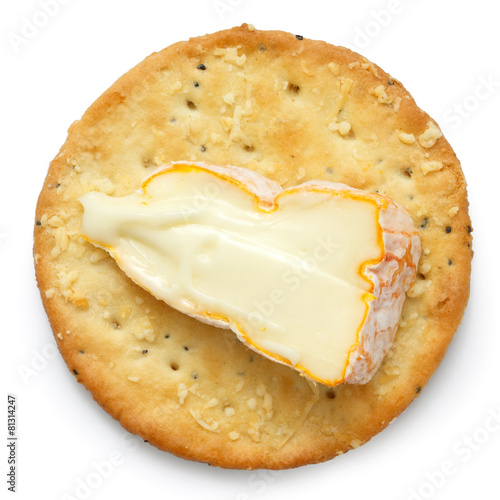 Crispy round cheese cracker from above. With French cheese.