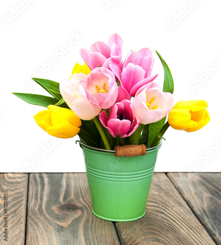 Bucket with colorful tulips