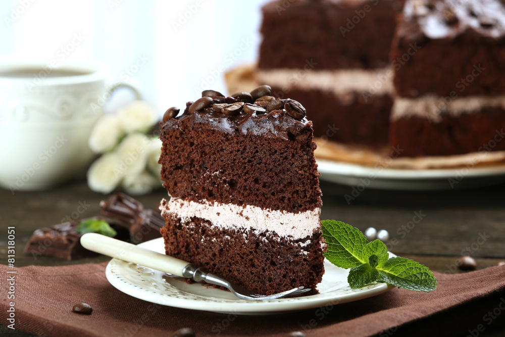 Delicious chocolate cake on table on light background Delicious chocolate cake on table on light background