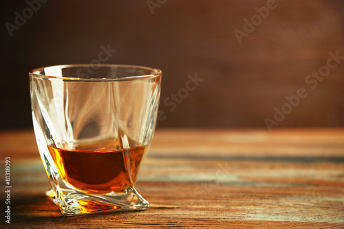 Whiskey on wooden background