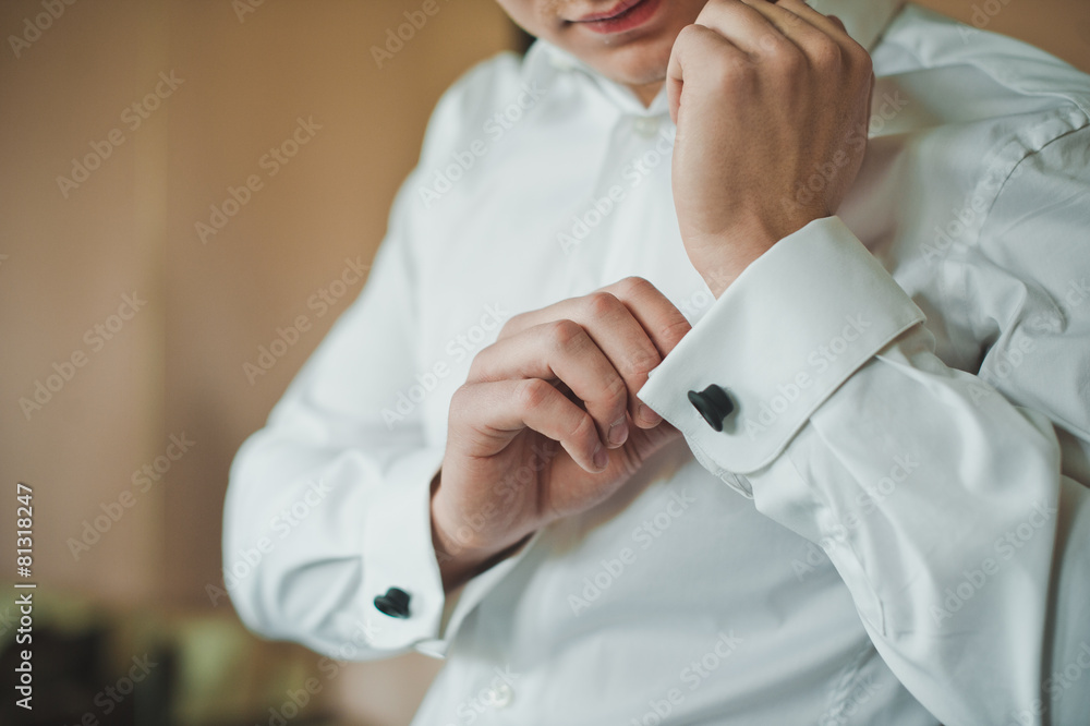 Process of clothing of cuff links on a shirt 2414. Process of clothing of cuff links on a shirt 2414.