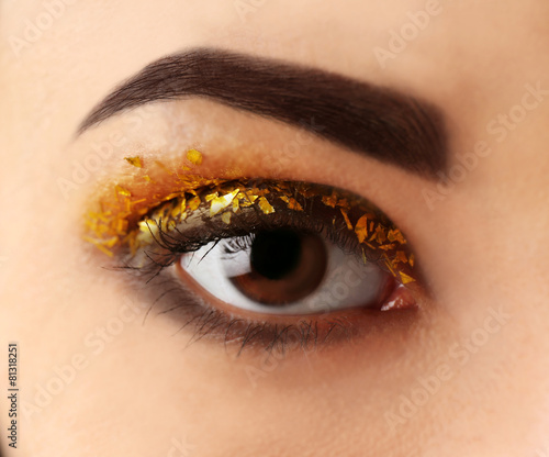 Female eye with fancy glitt...