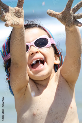 happiness and playing on the beach photo