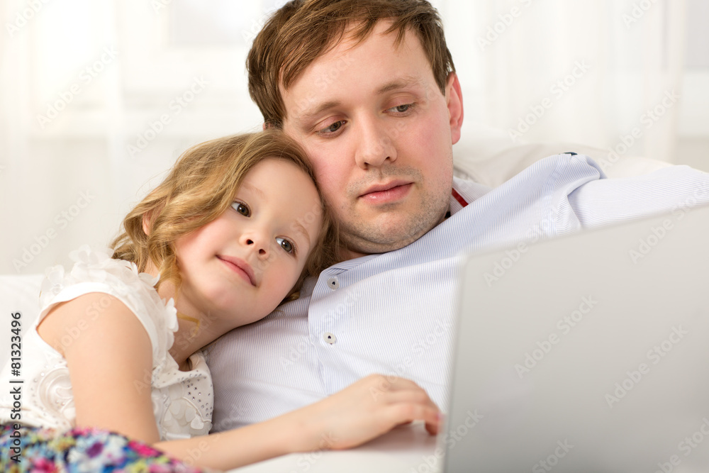 Father and little daughter using laptop Father and little daughter using laptop