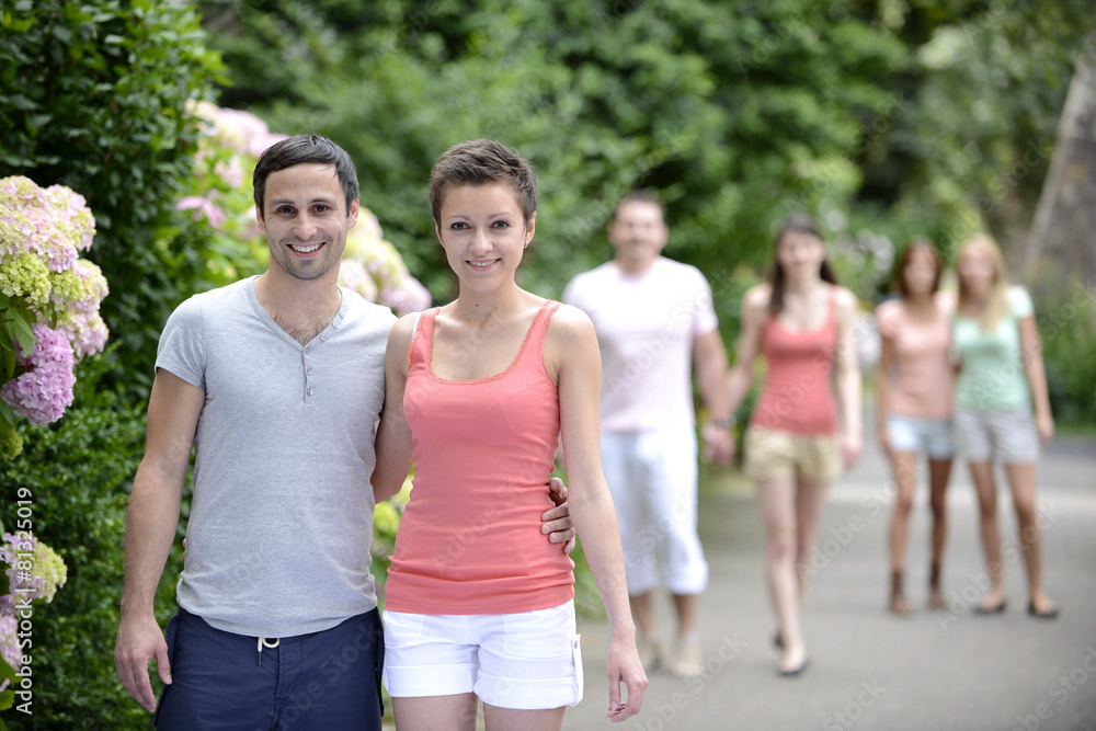 Group of people with couples walking outdoors