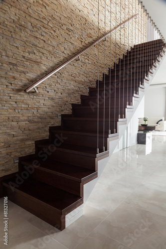 Brick wall and wooden stairs