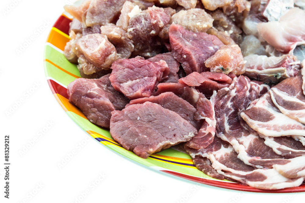 Mixed meat in colorful ceramic plate