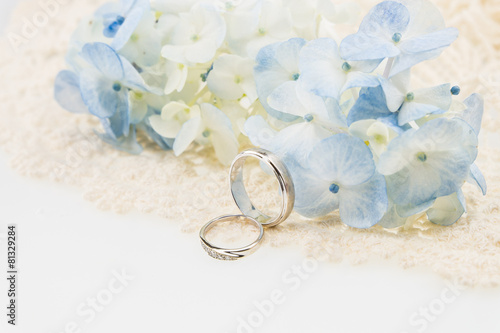wedding ring with blue hydrangea on  ivory lace