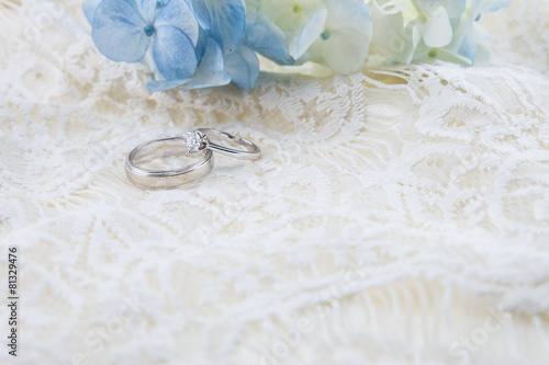 wedding ring with blue hydrangea on  ivory lace