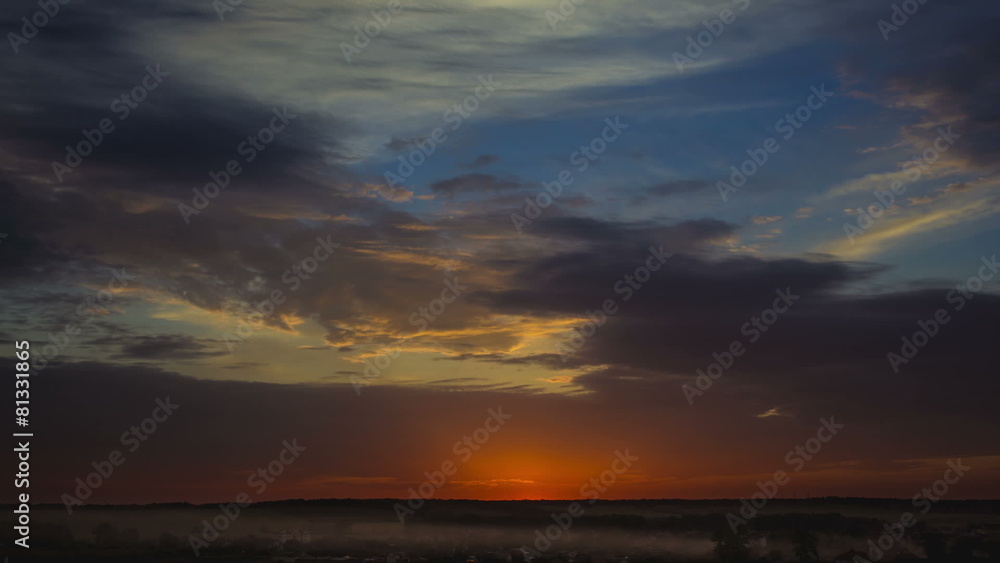 Picturesque sunset with thunderstorm clouds above village Picturesque sunset with thunderstorm clouds above village